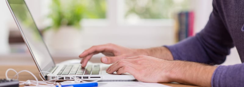 Guy at computer blog header